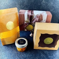a gift box with a jar of honey and a jar of jam